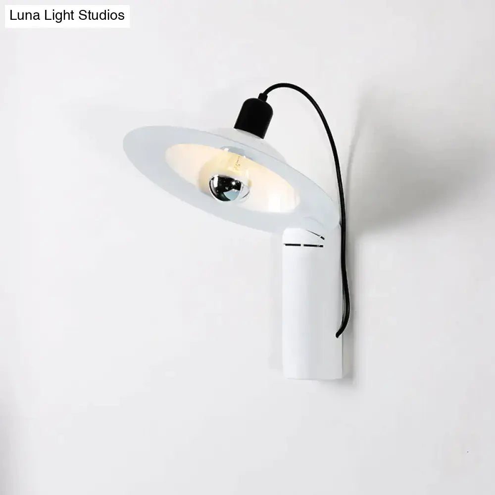 Modern white wall sconce with a sleek curved arm and frosted glass shade for adjustable bedroom reading lighting