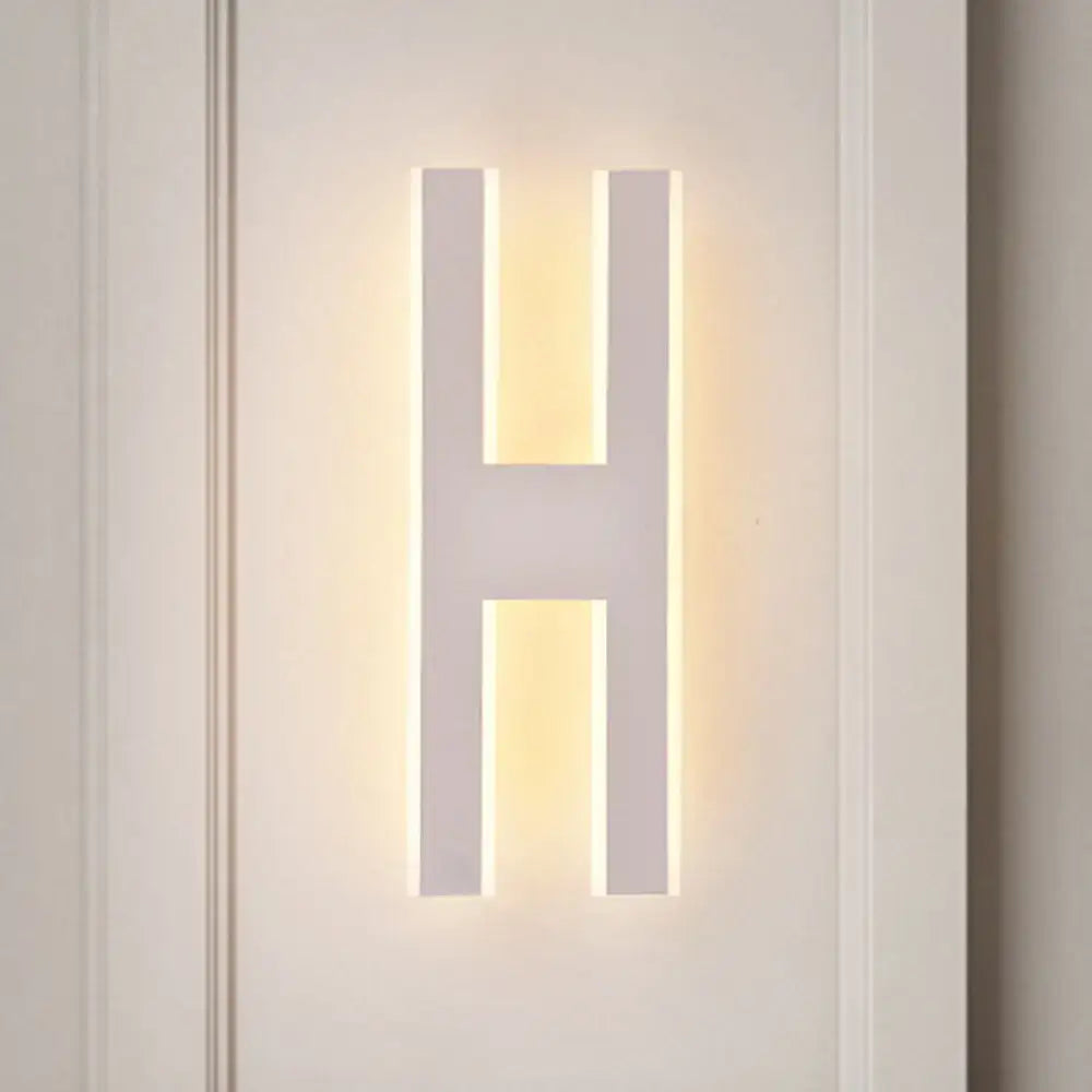 Modern white alphabet wall lamp in sleek acrylic with warm led lighting shaped like letter h for 110v-120v use