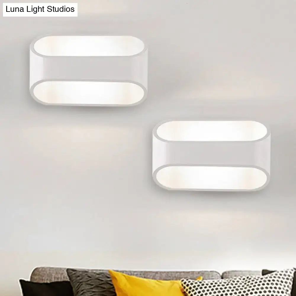 Modern white aluminum led wall sconce with an oval minimalist design ideal for bathroom lighting