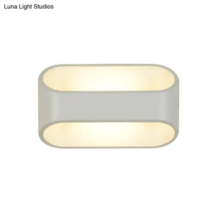 Modern white aluminum led wall sconce with oval shape, sleek matte gray finish, and warm diffused lighting for bathroom