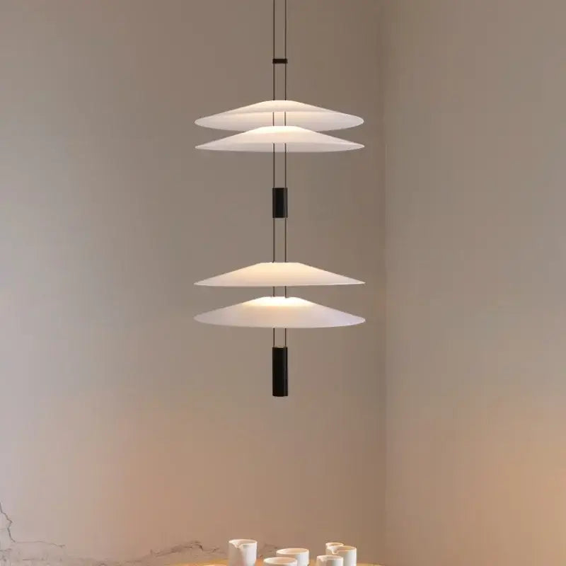 Modern white and black circular pendant light with three translucent disc shades by decorbites circular pendant light
