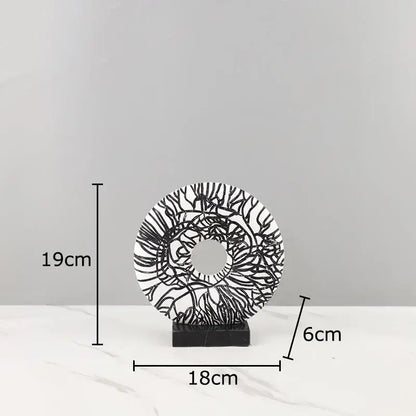 Modern white and black floral decorbites circle ornament with intricate line patterns on black marble base for living room decor