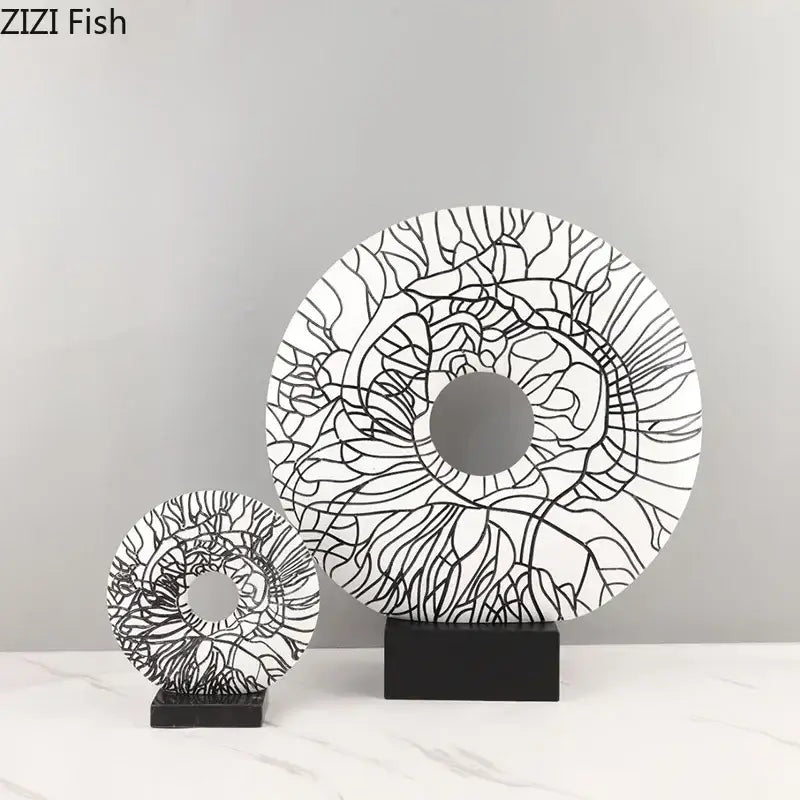 Modern white and black floral decorbites circle ornament with intricate patterns on a sleek black stand for living room decor