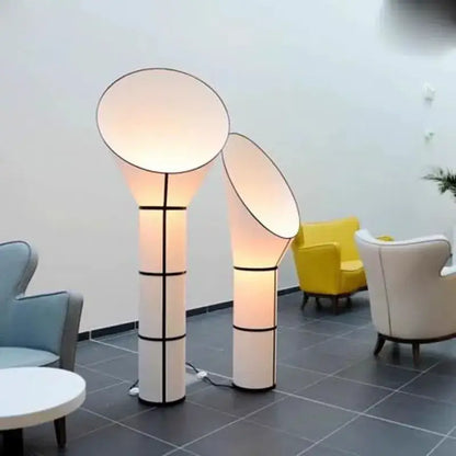 Modern white and black horn floor lamp with geometric accents and soft diffused glow for bedroom decorbites floor lamp