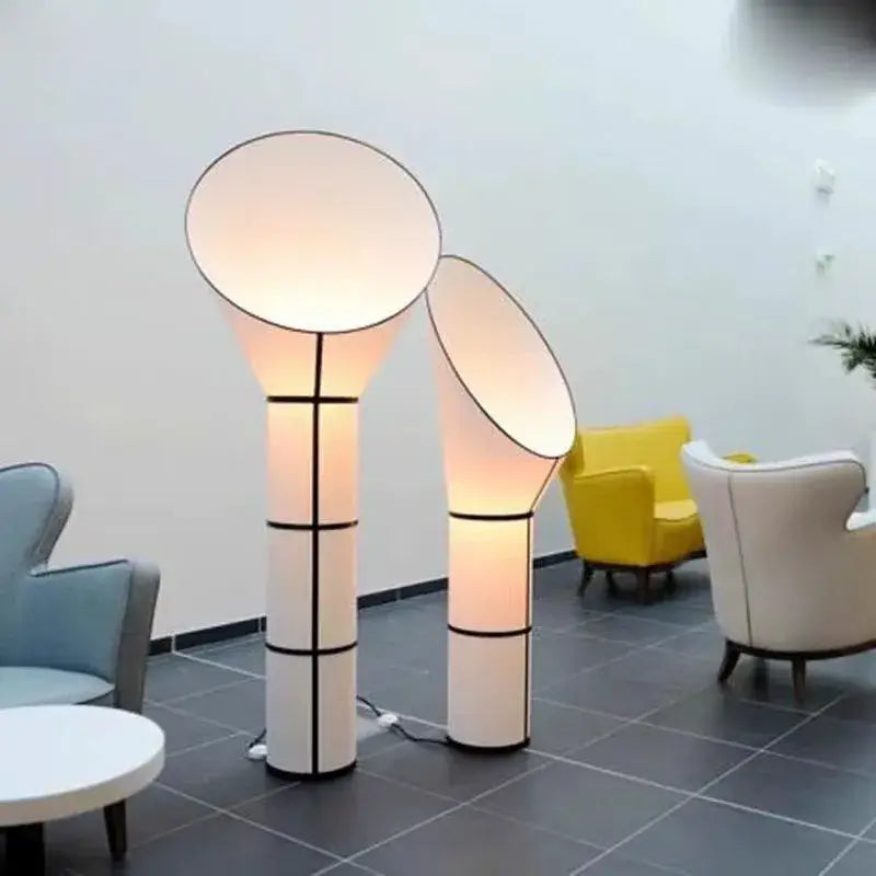 Modern white and black horn floor lamp with geometric accents and soft diffused glow for bedroom decorbites floor lamp
