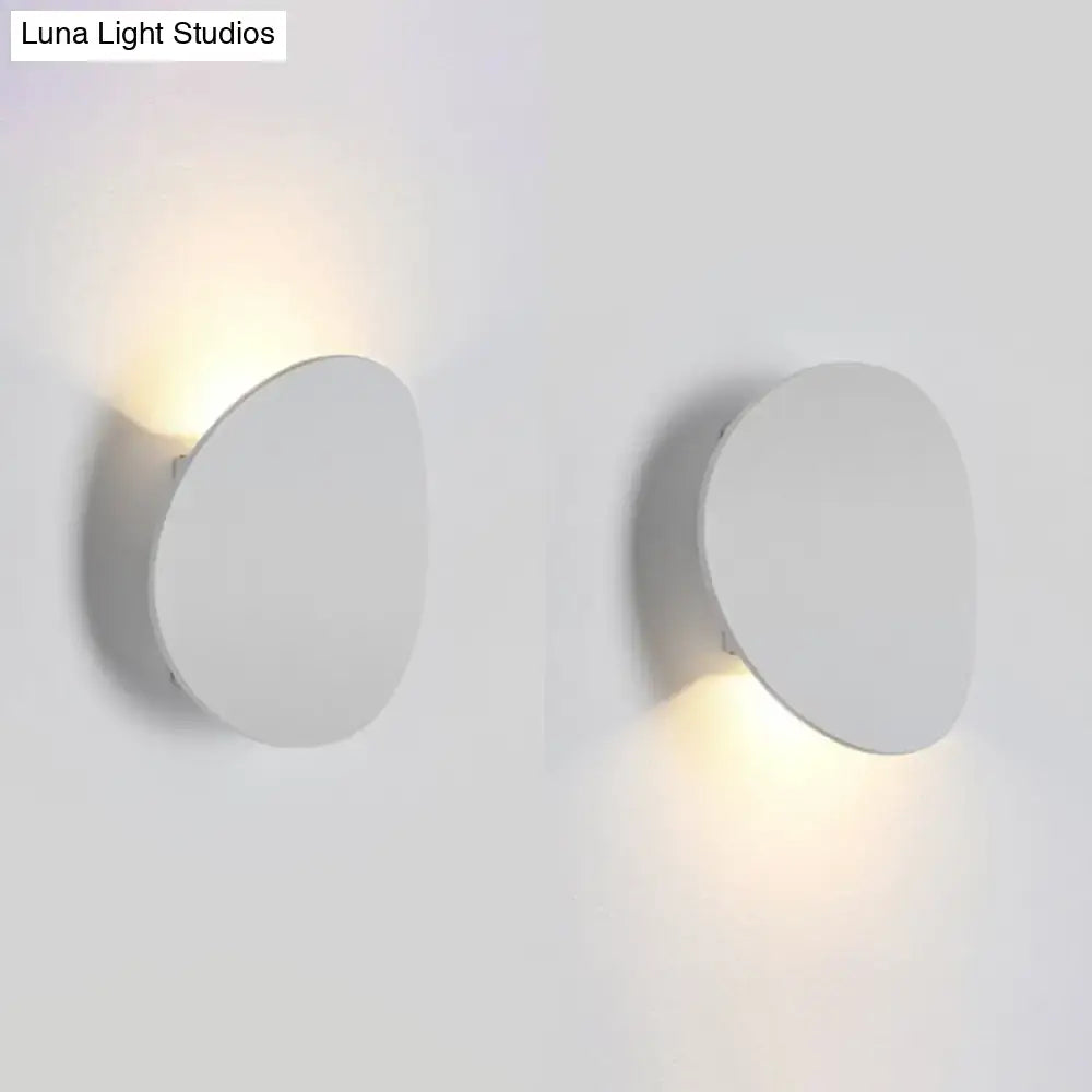 Minimalist modern style white oval wall sconce with soft warm led light for bedroom use