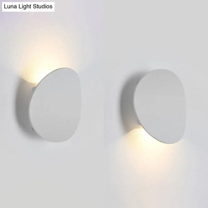 Minimalist modern style white oval wall sconce with soft warm led light for bedroom use