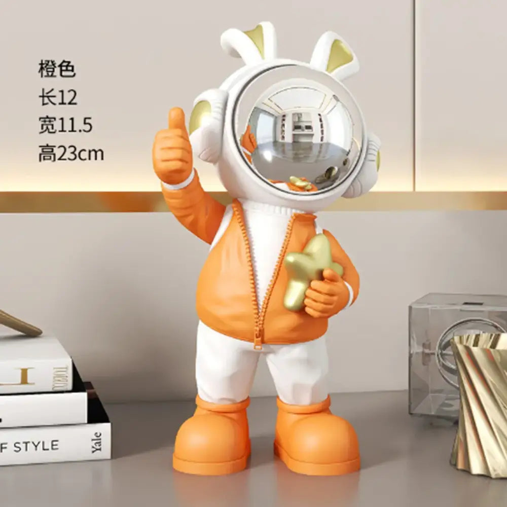 Modern white and blue astronaut resin sculpture featuring an orange astronaut resin with bunny ears for living room decor