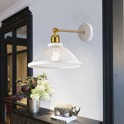 Modern white and brass iron net wall lamp with white glass pendant and gold-finished metal arm decorbites iron net wall