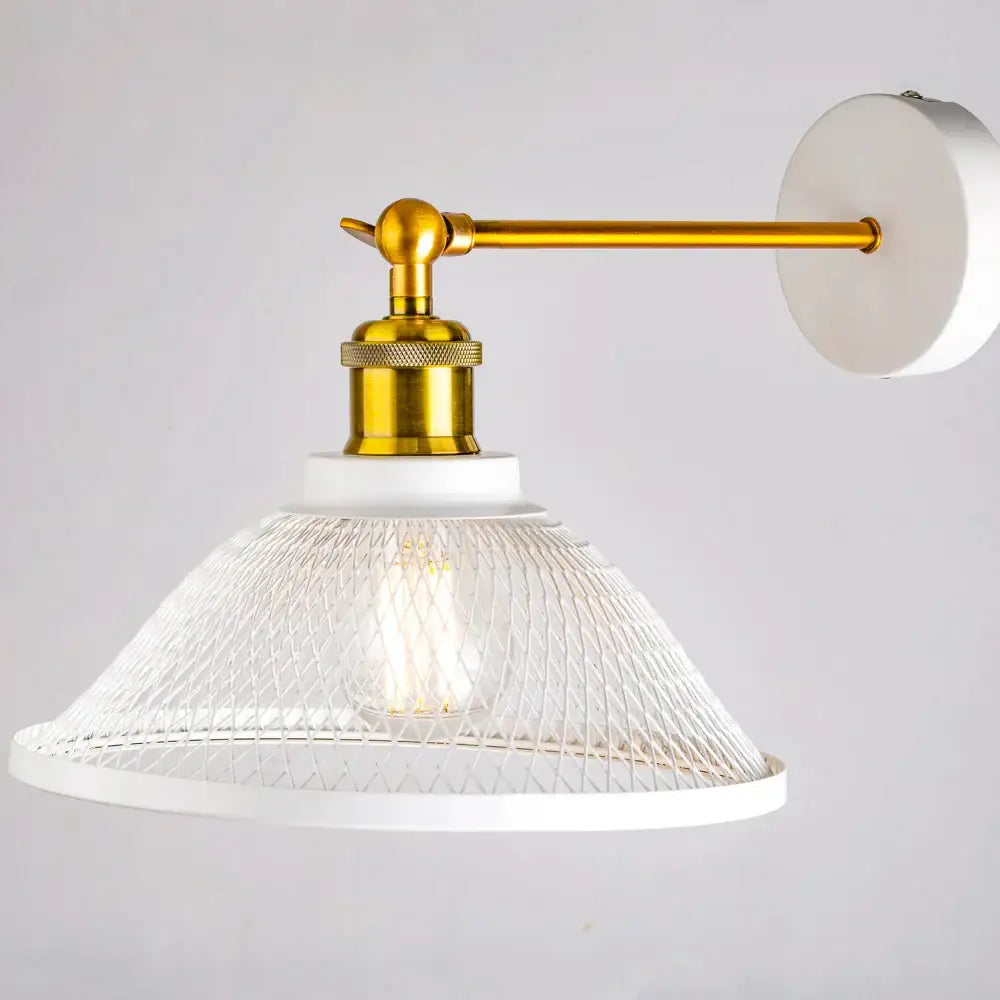 Modern white and brass iron net wall lamp with a gold arm and clear glass mesh shade for bedroom decorbites iron net