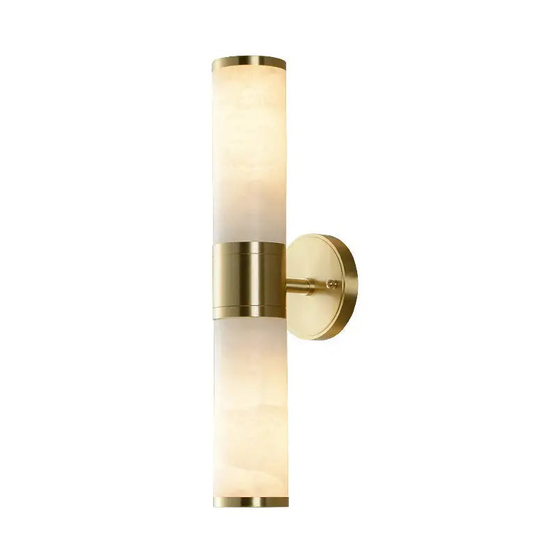 Modern white and brass pillar shaped sconce light with frosted alabaster glass shade for bedside wall lamp use