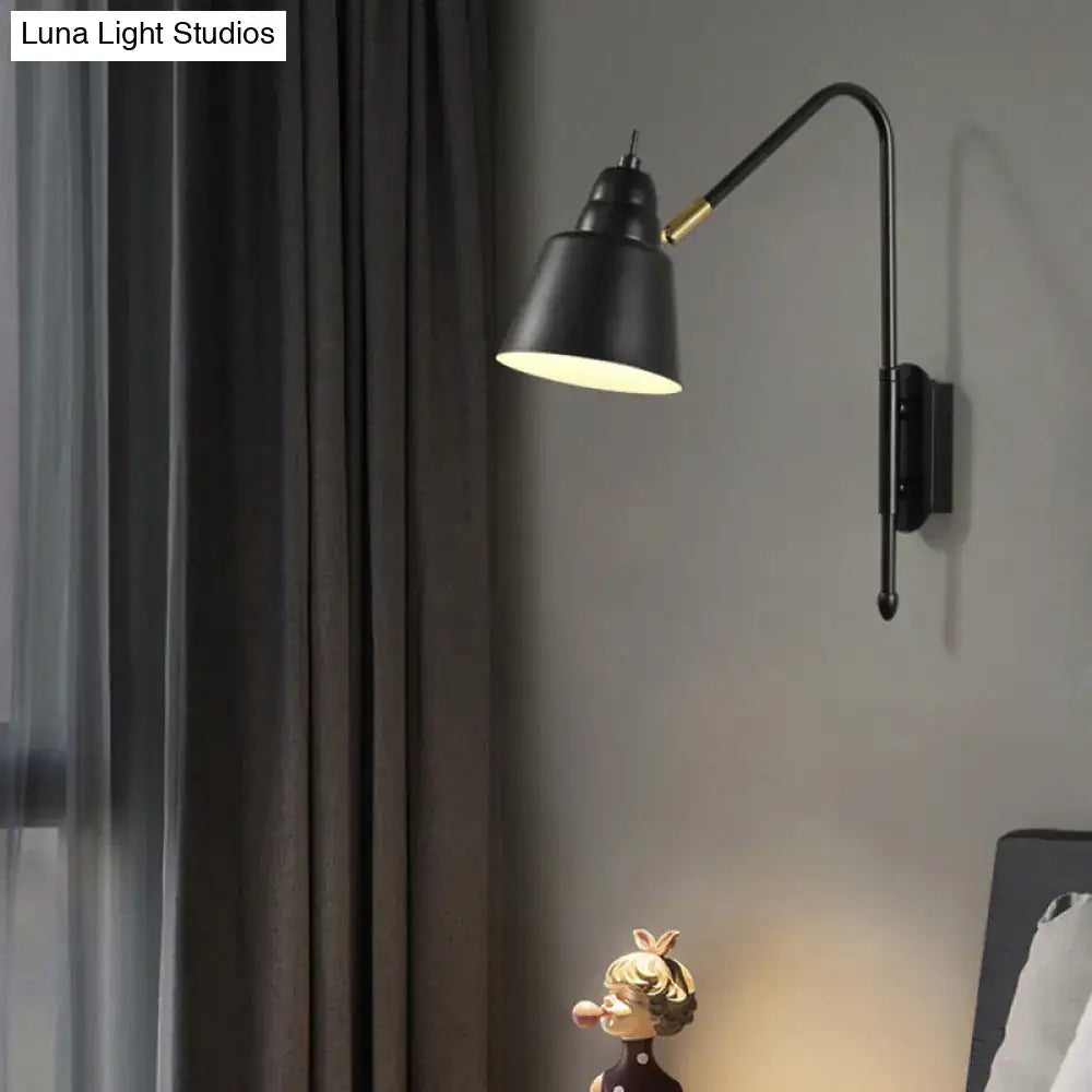 Black industrial-style wall-mounted reading lamp with curved arm and gold accent for modern bedroom light type