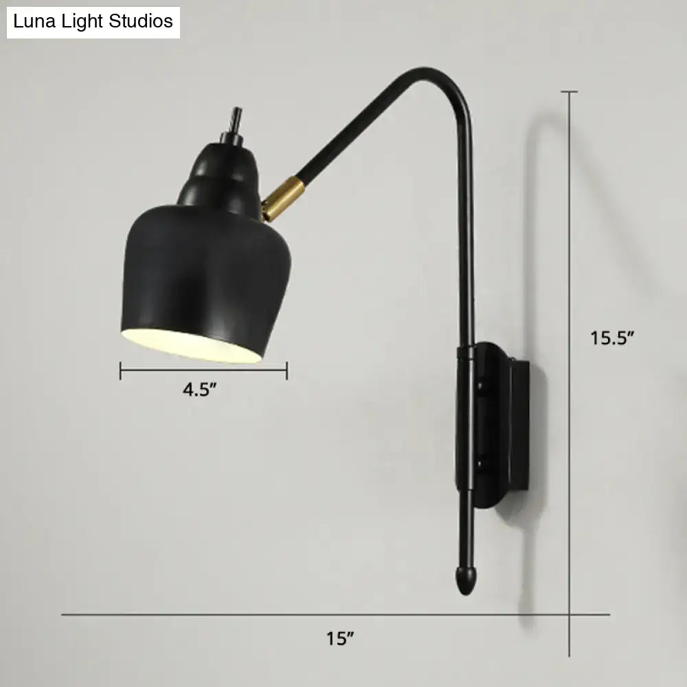 Modern white and brass v-shaped wall light with black matte curved arm and gold accent joint light type for bedroom reading