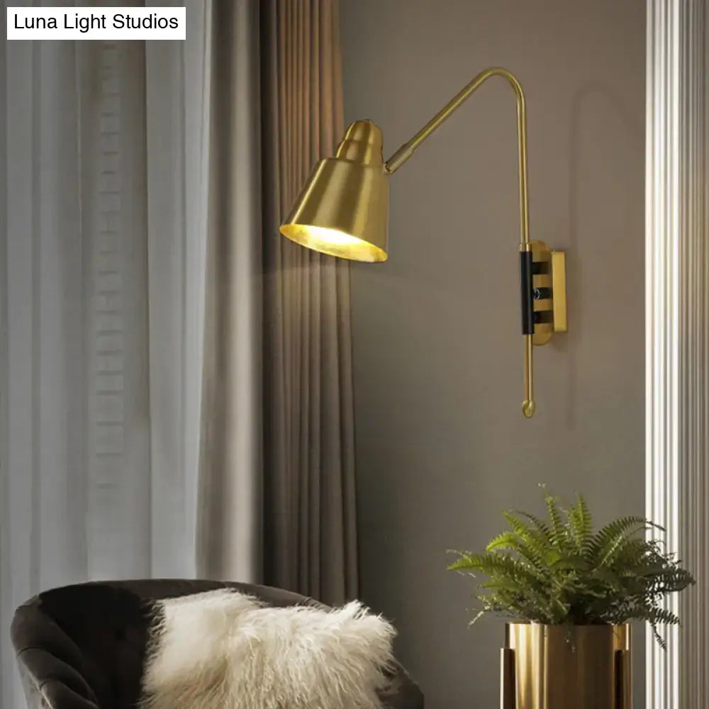 Gold finished modern white and brass wall-mounted reading lamp with articulated arm and conical shade light type