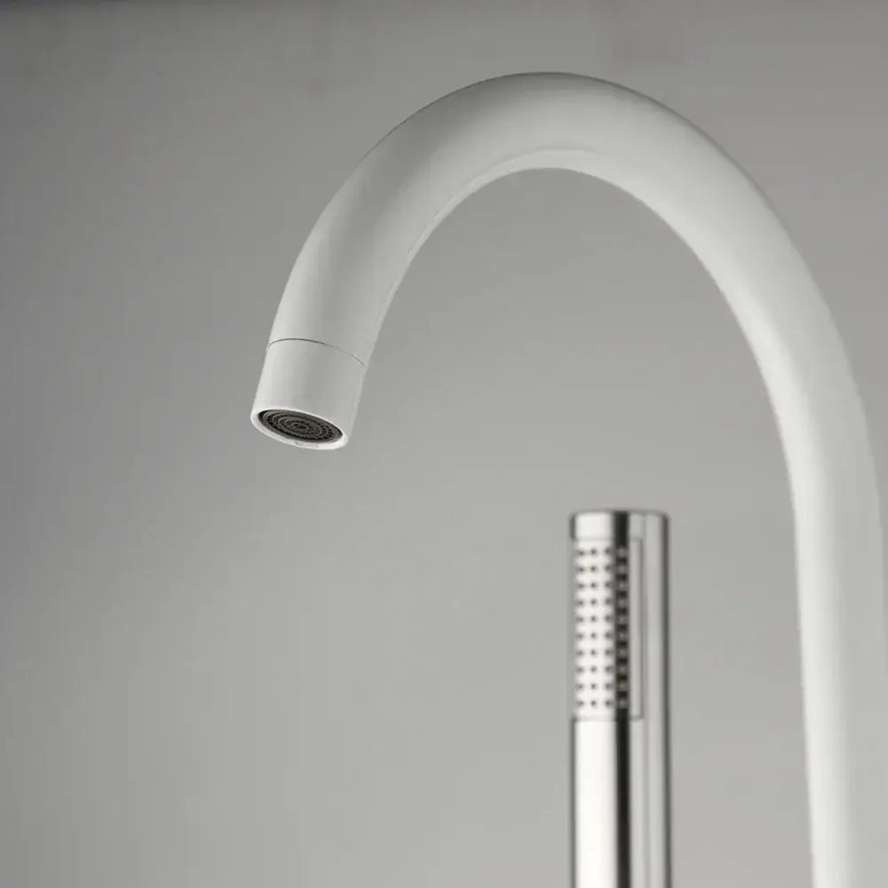 Modern white and chrome bathtub faucet set with curved faucet and chrome showerhead attachment for bathroom floor mount