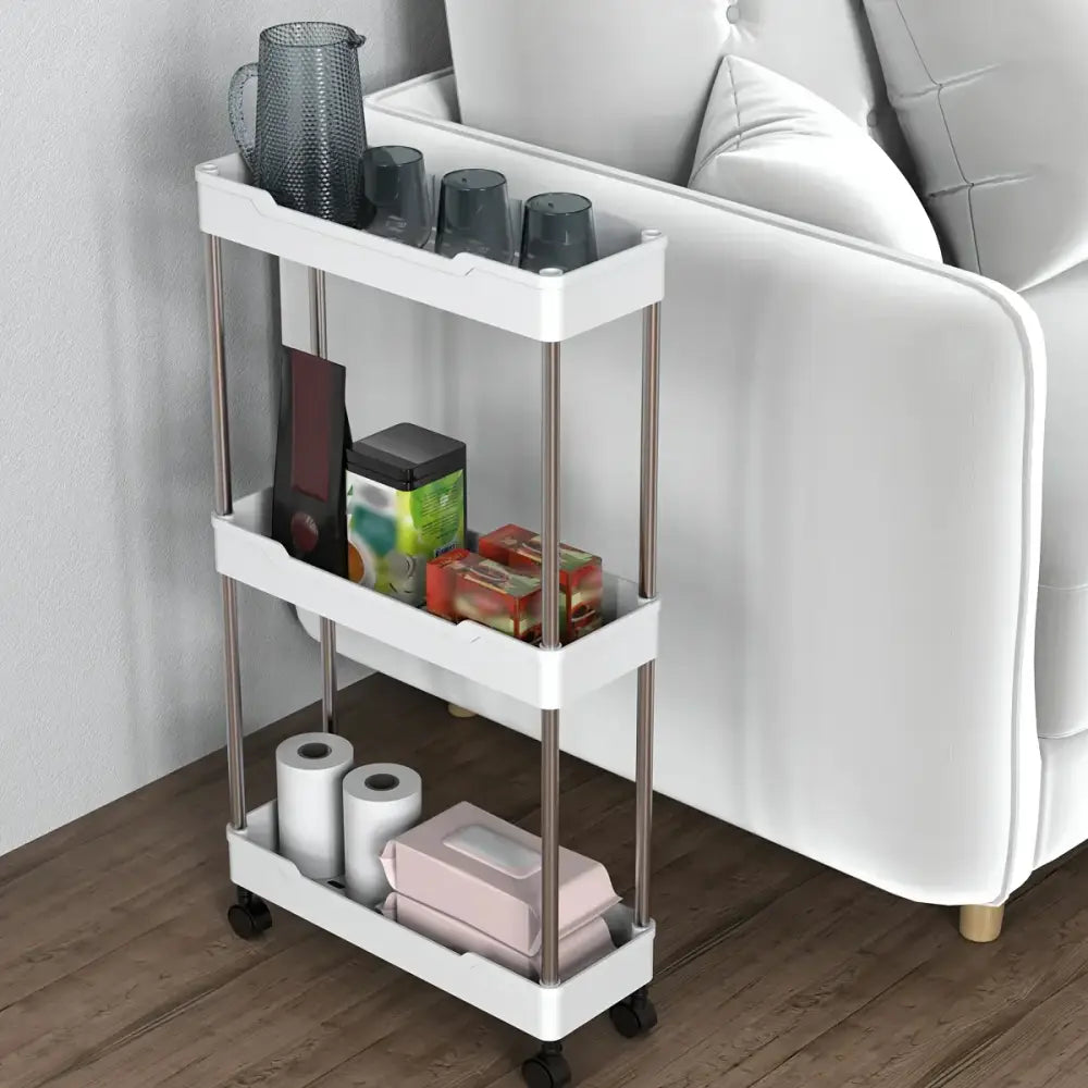Modern white and chrome three-tier rolling utility cart with stainless steel legs and black wheels bathroom storage rack