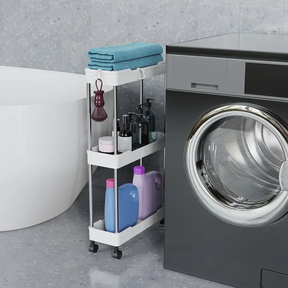 White three-tier rolling utility cart with chrome frame and black wheels holding teal towels and laundry products for bathroom storage rack