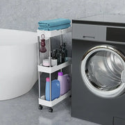 White three-tier rolling utility cart with chrome frame and black wheels holding teal towels and laundry products for bathroom storage rack
