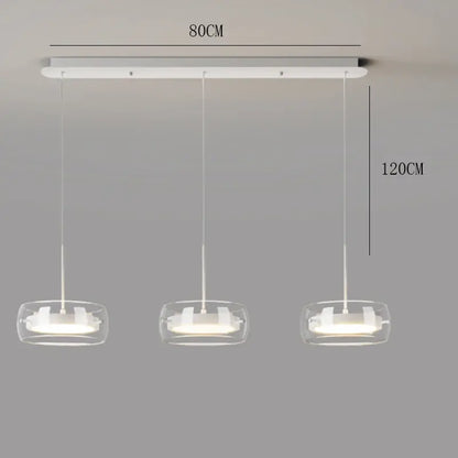 Modern white pendant light with three clear glass shades and rectangular mount ideal for remote dimming in dining room