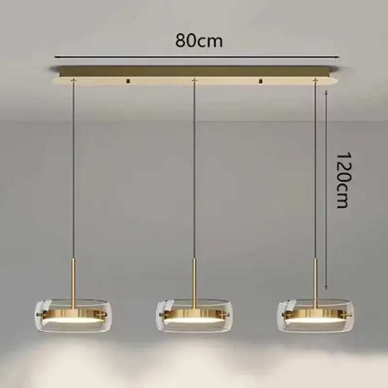 Modern gold-toned pendant light with three clear glass shades for dining room featuring remote dimming control