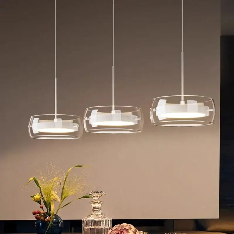 Modern white and clear glass ring pendant light with remote dimming featuring three glass shade lights for dining room