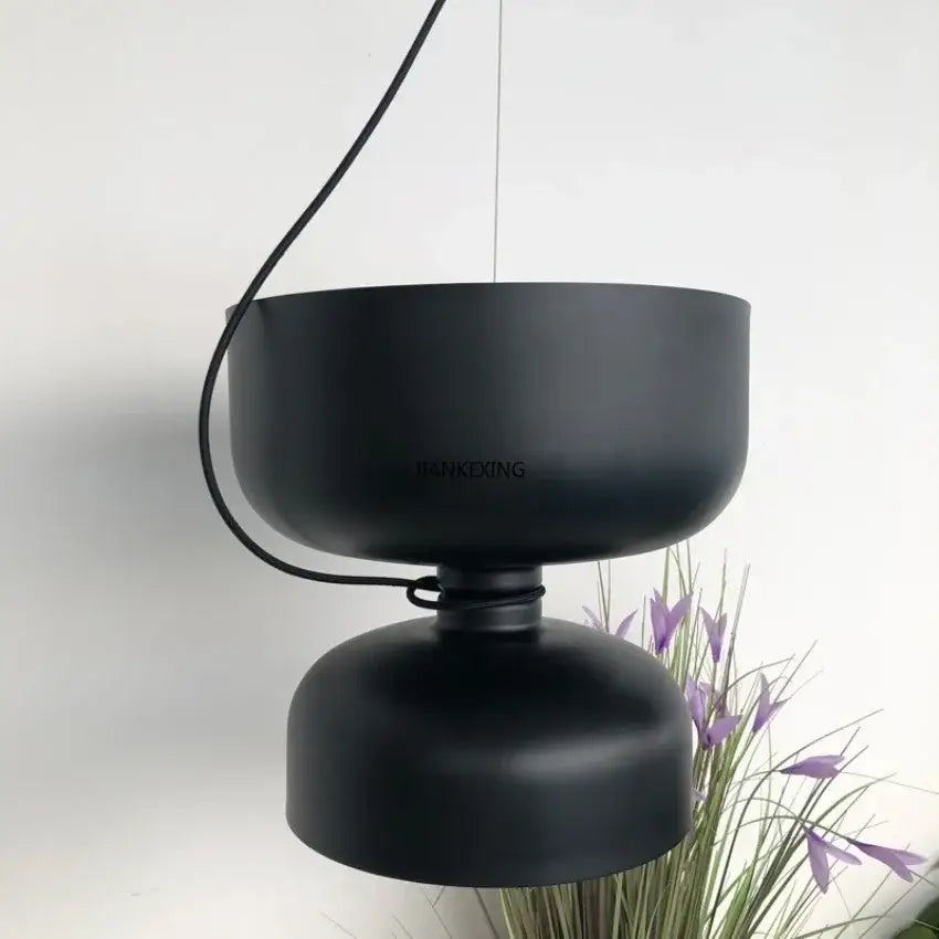 Black matte pendant light with two stacked circular shades, a decorbites designer iron chandelier for modern dining rooms
