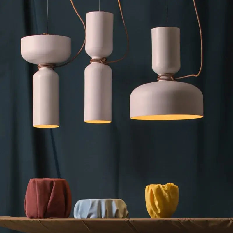 Modern white and copper ceramic pendant light with warm interiors featuring decorbites designer iron chandelier design