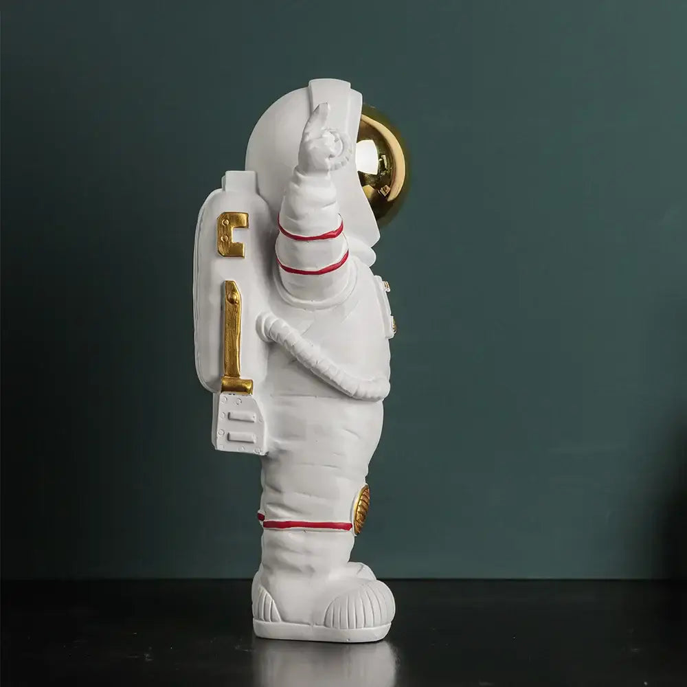 Modern white astronaut figurine with electroplated golden accents and red stripes for living room decor