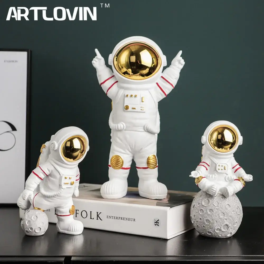 Modern white astronaut figurine with electroplated golden visor and red stripes standing on a book for living room decor