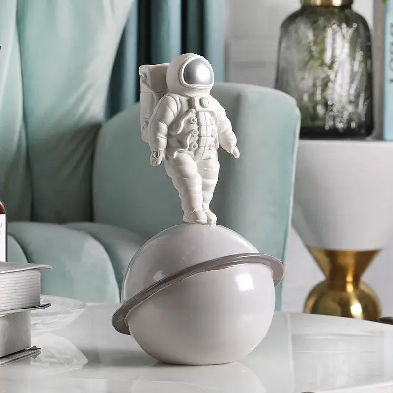 Modern white and gold astronaut phone holder figurine with glossy white planet and gray ring decorbites astronaut phone decor