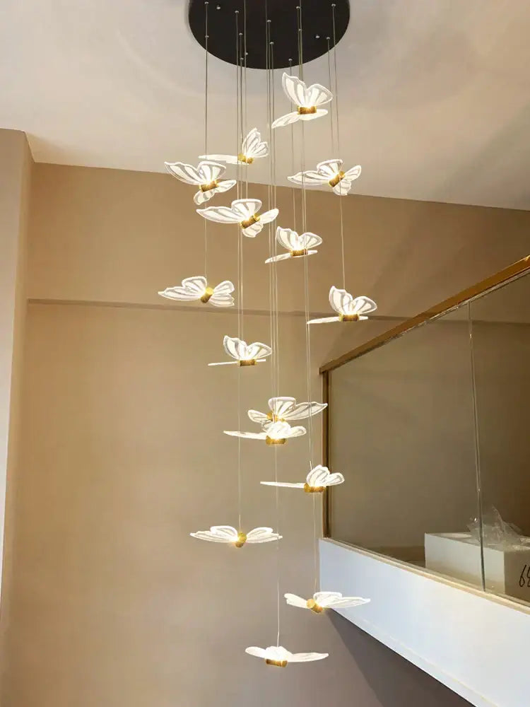 A modern white and gold butterfly chandelier with translucent butterfly lights and black circular base for bedroom decorbites butterfly chandelier