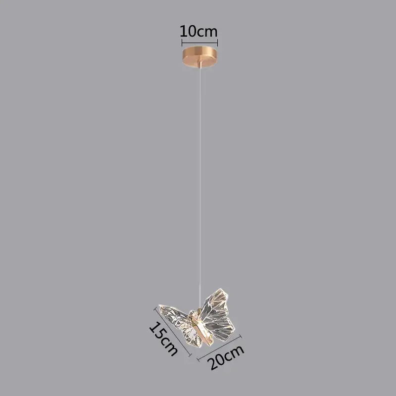 Modern white and gold butterfly pendant lights featuring a delicate transparent crystal butterfly pendant on a gold mount