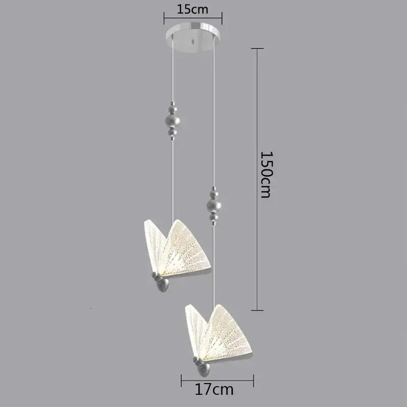 Silver-finished modern butterfly pendant lights with translucent patterned wings and beaded accents for bedroom decor