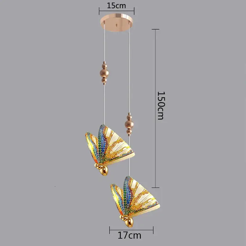 Modern white and gold butterfly pendant lights featuring gold-toned butterfly design with iridescent wings and beaded accents for decorbites butterfly pendant lighting