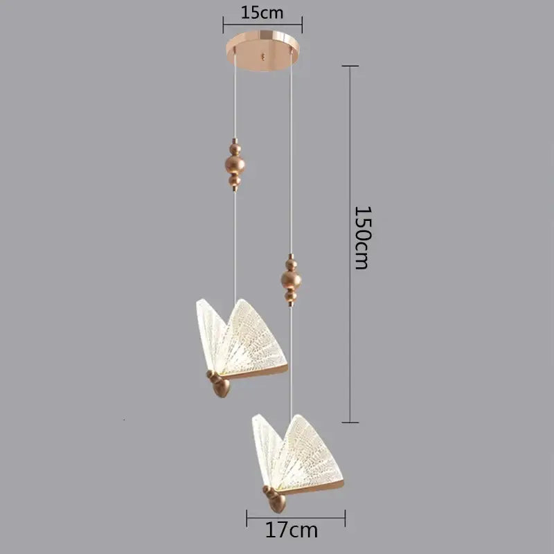 Gold-toned decorbites butterfly pendant light with two translucent textured butterfly lamps and circular ceiling mount