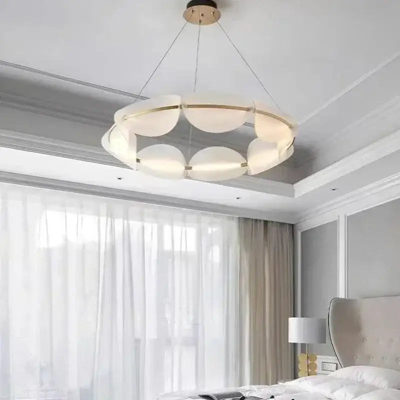 Modern white and gold circular led pendant light with frosted glass panels and metal accents for living room decorbites circular led