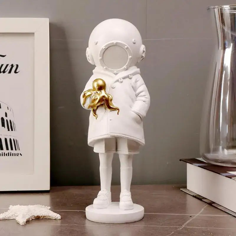 Modern white and gold deepsea diver sculpture featuring a white astronaut figurine holding a golden octopus for living room decor