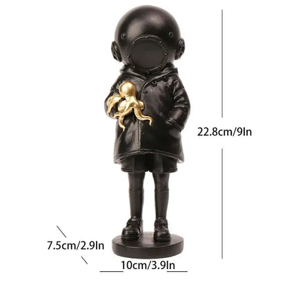 Black resin deepsea diver sculpture of a child in a vintage helmet holding a golden octopus for living room decor