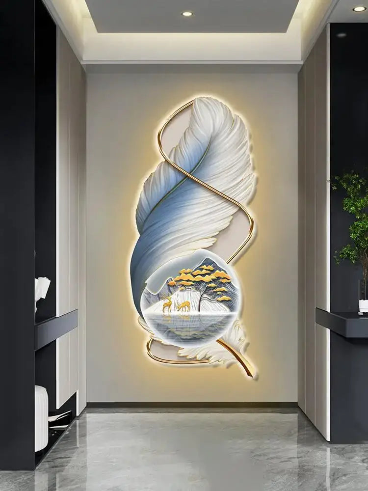 Modern white and gold feather led wall lamp featuring a luminous sculptural design with embedded circular landscape scene