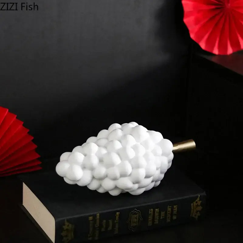 White resin grape skewer desk ornament with a gold stem for modern dining room decorbites grape skewer decor