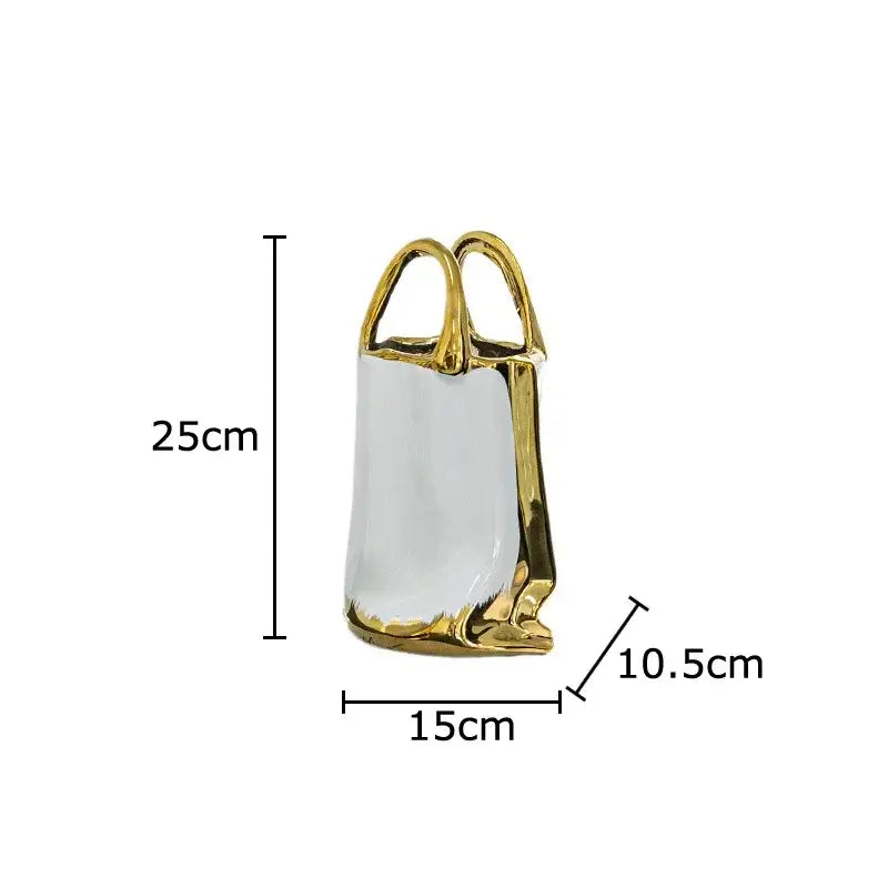 Modern white and gold handbag ceramic vase with glossy white interior and decorbites golden handbag design for living room decor