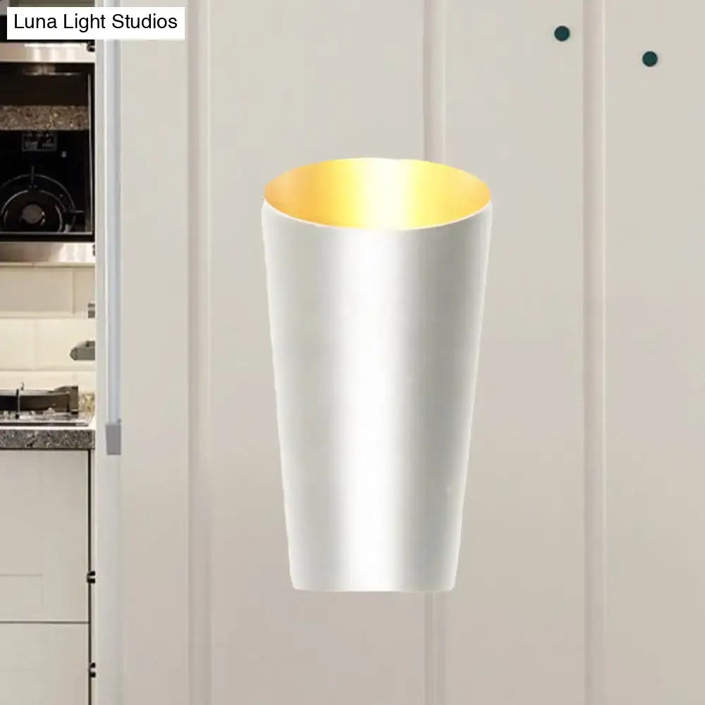 A sleek modern led white and gold bedside sconce wall light with a warm gold interior lining for bedrooms