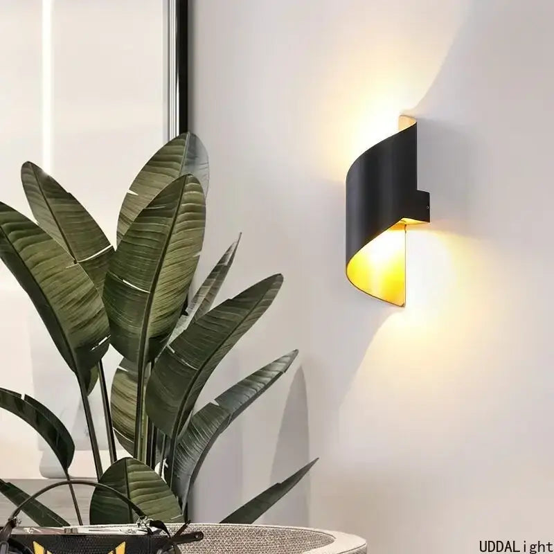 Modern white and gold outdoor wall lamp with spiral design and warm yellow lighting for patio or outdoor wall use