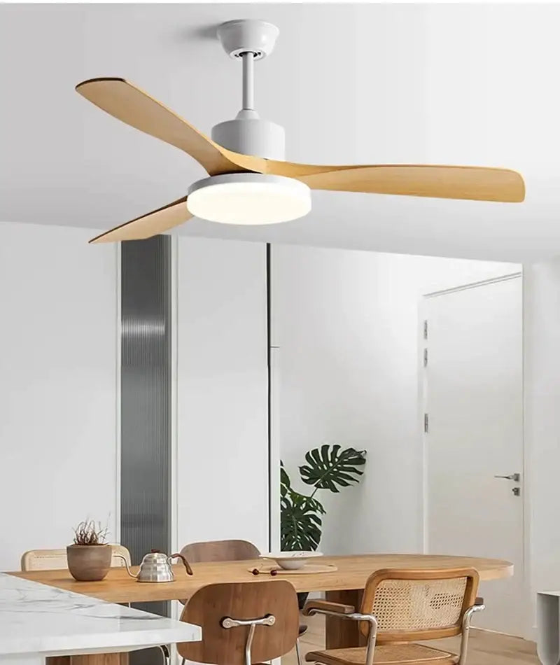 Modern ceiling fan with four slender light wood blades and white housing featuring an led lamp for bedroom use