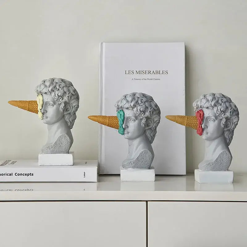 Gray resin busts with colorful ice cream cones on noses paired with modern white and pink ice cream horse head decorbites horse head living room sculpture