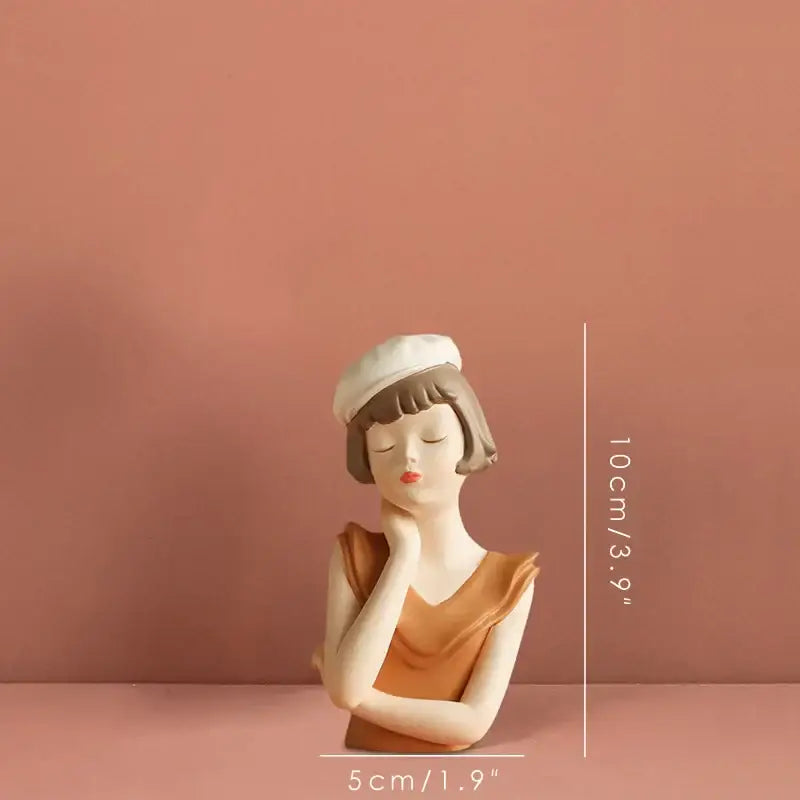 Delicate ceramic balloon girl bust tray in white and tan featuring a woman with closed eyes and a white beret