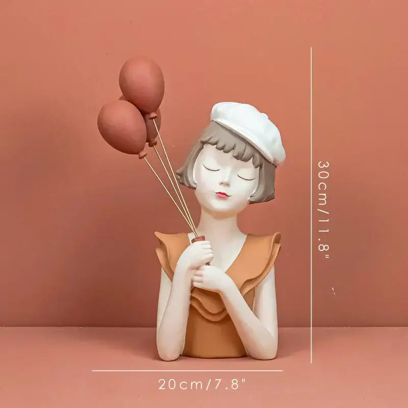 Modern white and tan balloon girl bust sculpture in matte resin featuring a girl in white beret holding terracotta balloons