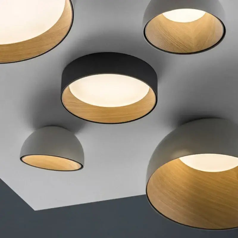 Modern white and wood duo ceiling light with circular black outer casing and warm wood-toned inner lining for kitchen dome lamp