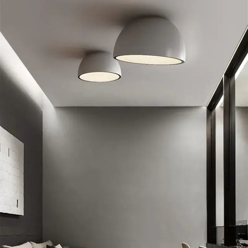 Two sleek matte gray dome duo ceiling lights with warm diffused illumination for modern kitchen lighting