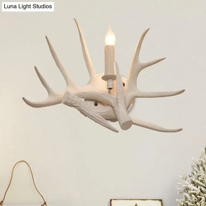 Modern white antler resin shade wall sconce featuring a white ceramic deer antler design with candle-style bulb for living room lighting